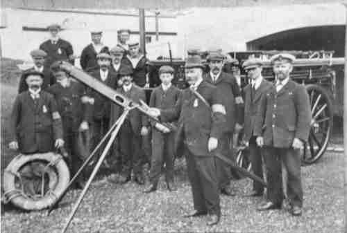 A group of coastguards standing beside a rocket line, similar to that used for the Bell Hill incident.